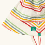 Close up of the Little Green Radicals cream rainbow stripe reversible organic cotton sunhat. Red, pink, yellow blue and green stripes on a cream background.