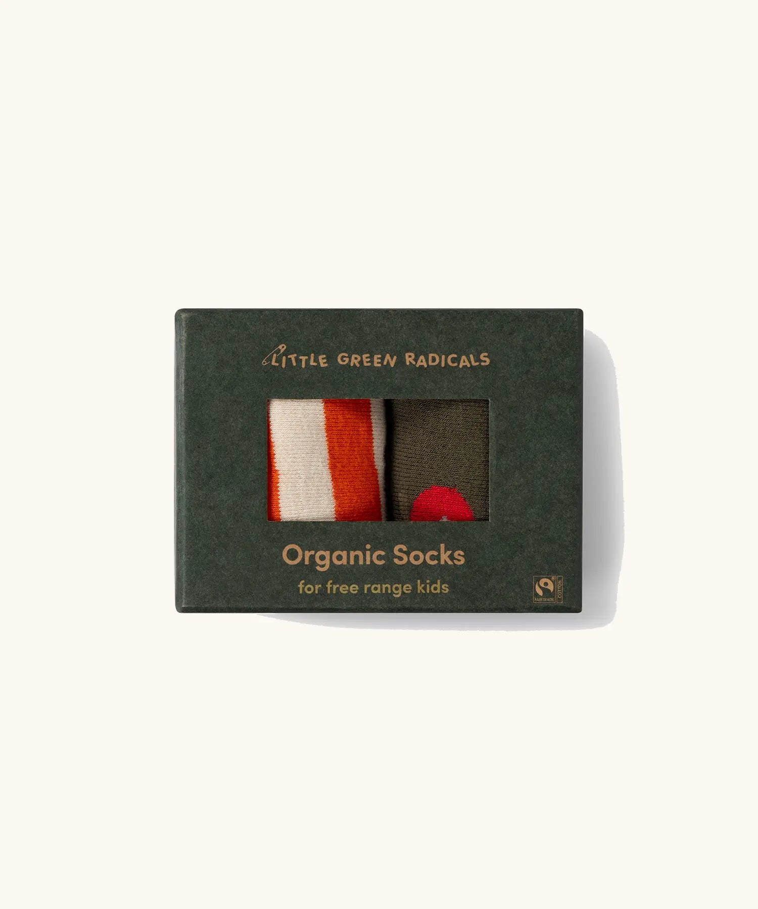 Little Green Radicals red apple organic cotton boot socks in a 2 pack in the cardboard gift box packaging. One dark green pair with red apple print, one white and orange stripes.