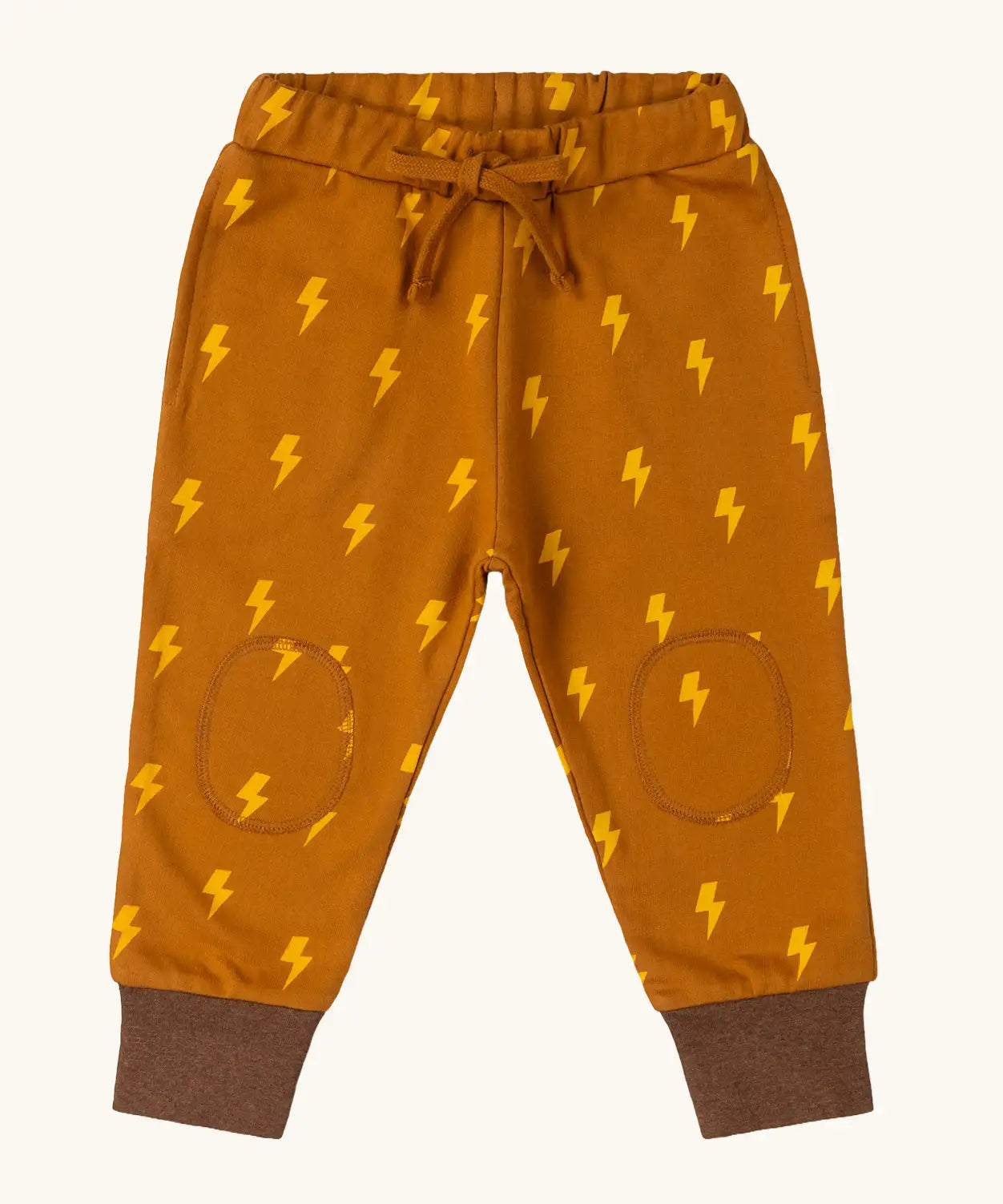 Little Green Radicals yellow gold repeat lightning print cosy organic cotton kids joggers.