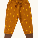 Little Green Radicals yellow gold repeat lightning print cosy organic cotton kids joggers.