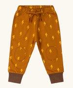 Little Green Radicals yellow gold repeat lightning print cosy organic cotton kids joggers.