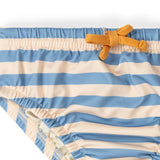 Close up of the elasticated waist on the Little Green Radicals Hazy Blue Striped Reusable Swimming Nappy with yellow waist tie.