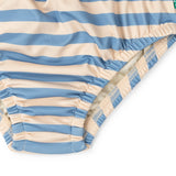 Close up of the elasticated legs on the Little Green Radicals Hazy Blue Striped Reusable Swimming Nappy with yellow waist tie.