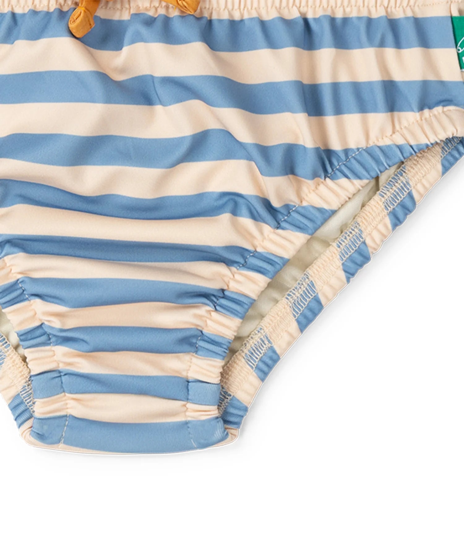 Close up of the elasticated legs on the Little Green Radicals Hazy Blue Striped Reusable Swimming Nappy with yellow waist tie.