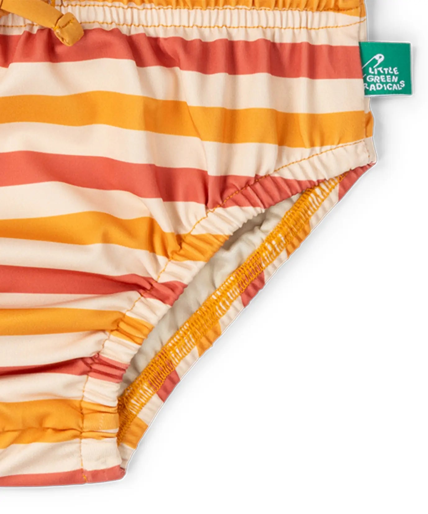 Elasticated legs on the Little Green Radicals Sorbet Striped Reusable Swimming Nappy. Cream, Red and yellow stripes with green logo tag on side.