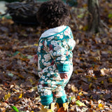 A child wearing the Little Green Radicals Organic Cotton Sherpa Fleece Snowsuit in the Hedgerow design.This organic cotton suit is a part of a wide range of organic cotton clothing for children available here at Babipur. 
