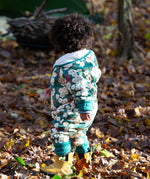 A child wearing the Little Green Radicals Organic Cotton Sherpa Fleece Snowsuit in the Hedgerow design.This organic cotton suit is a part of a wide range of organic cotton clothing for children available here at Babipur. 