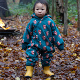 A child wearing the Little Green Radicals Sherpa Fleece Snowsuit , a Organic Cotton suit with a Red Foxes all over print on a dark green background. This lined snowsuit is a part of a wide range of organic cotton clothing for children available here at Babipur. 
