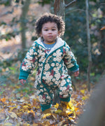 A child wearing the Little Green Radicals Organic Cotton Sherpa Fleece Snowsuit in the Hedgerow design.This organic cotton suit is a part of a wide range of organic cotton clothing for children available here at Babipur. 