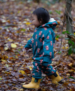 A child wearing the Little Green Radicals Sherpa Fleece Snowsuit , a Organic Cotton suit with a Red Foxes all over print on a dark green background. This lined snowsuit is a part of a wide range of organic cotton clothing for children available here at Babipur. 
