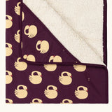 Close up of the Little Green Radicals sleeping swans organic sherpa hooded baby blanket.