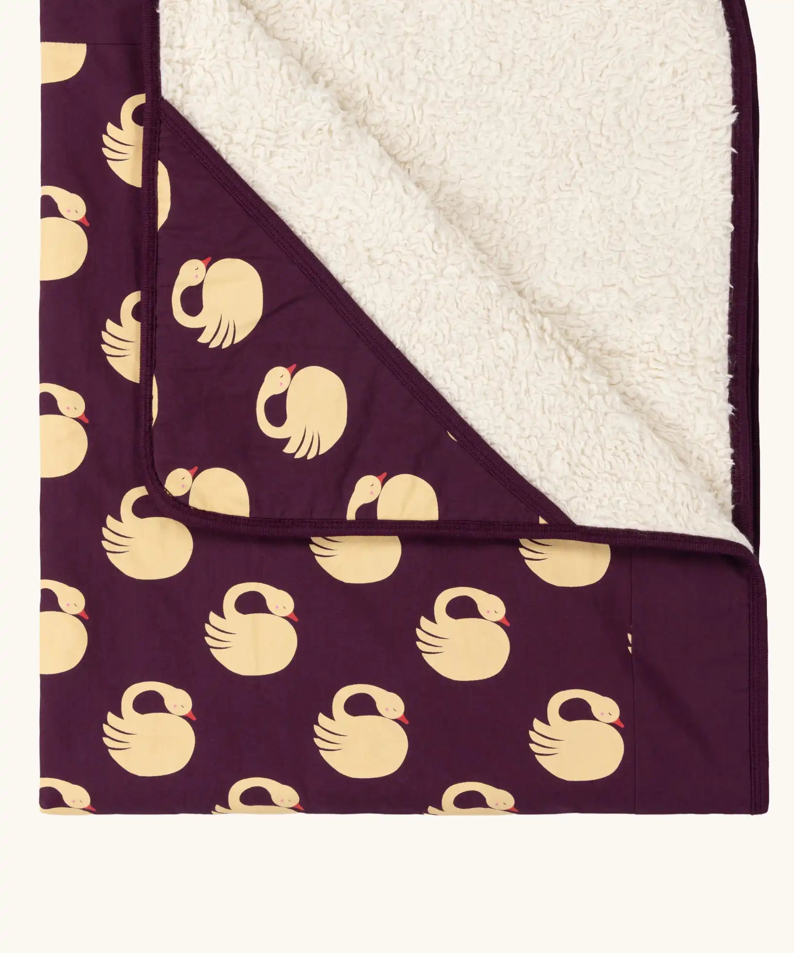 Close up of the Little Green Radicals sleeping swans organic sherpa hooded baby blanket.