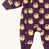 Close up of the leg cuffs on the Little Green Radicals purple sleeping swans print sherpa lined snowsuit.
