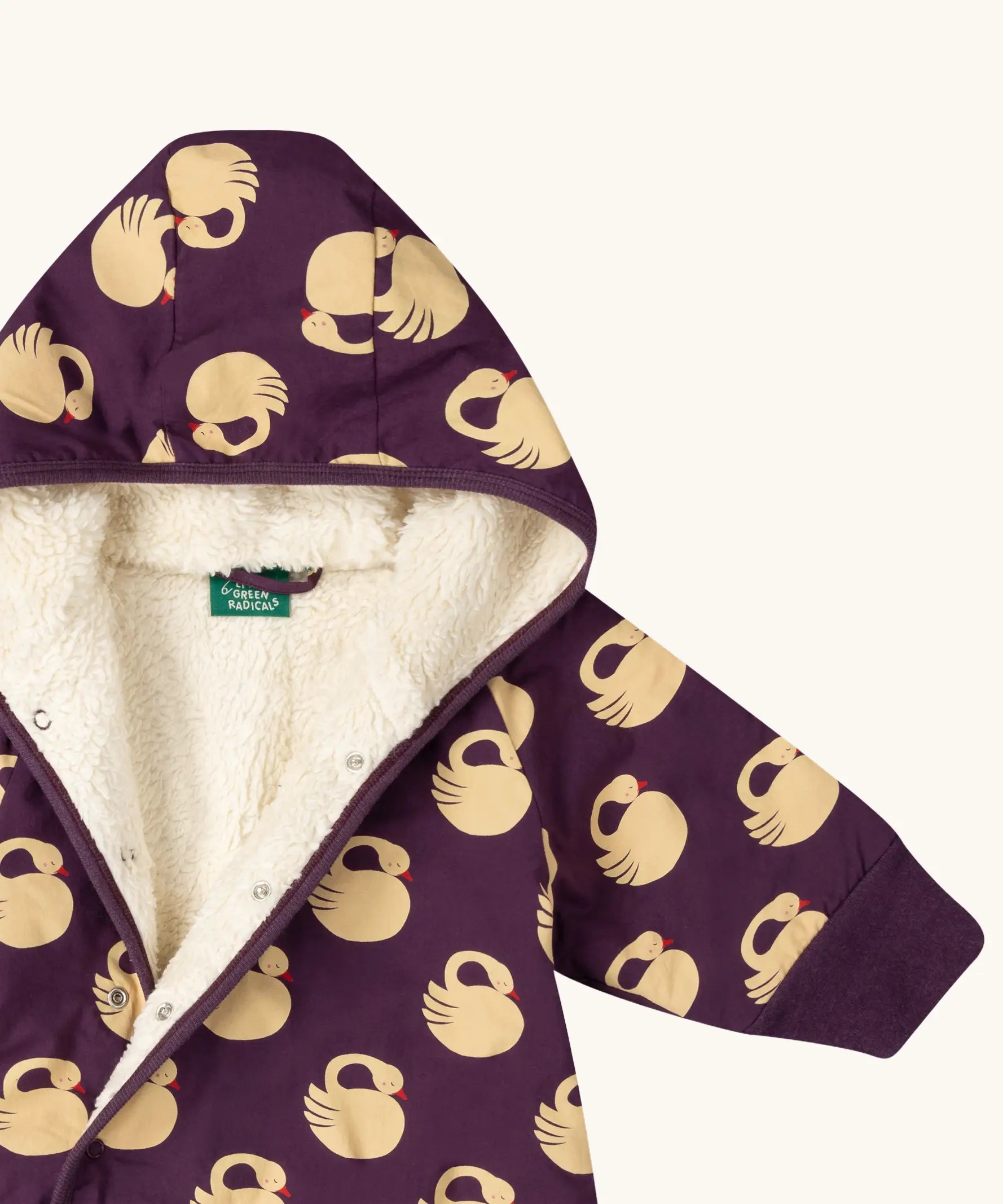 Close up of the inside of the Little Green Radicals purple sleeping swans print sherpa lined snowsuit.