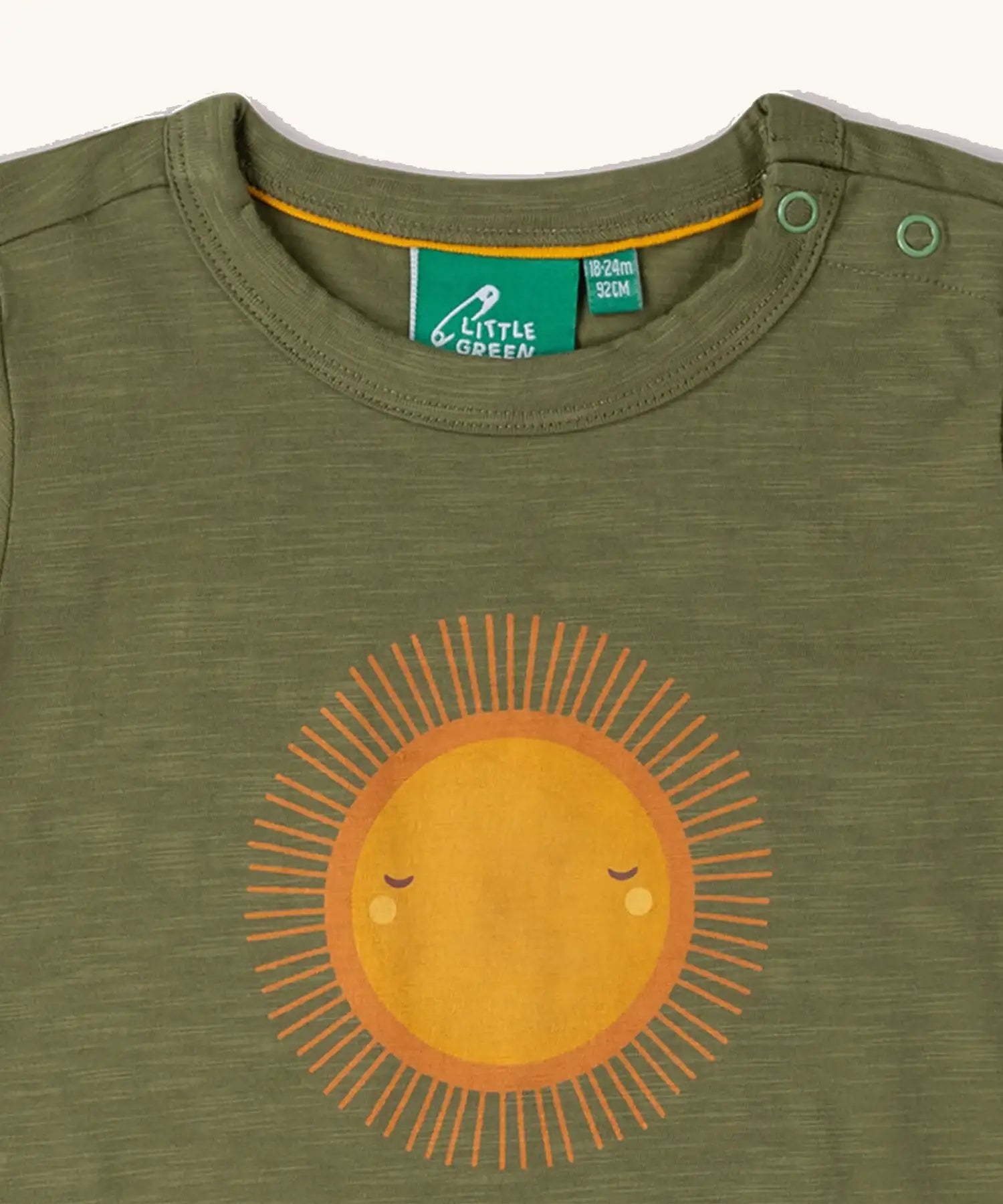 Close up of neck popper closure on the Little Green Radicals Summer rays sunshine short sleeve green popper organic-cotton t-shirt.