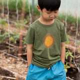 Child wearing the Little Green Radicals Summer rays sunshine short sleeve green organic-cotton t-shirt with blue shorts