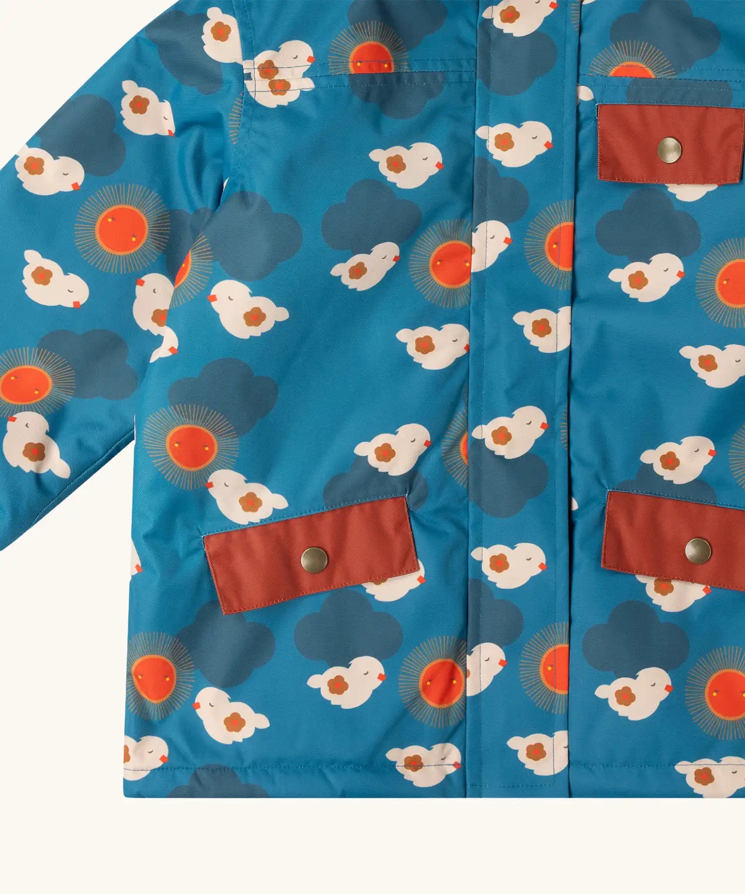 Close up of the pockets on the front of the Little Green Radicals blue sun birds recycled waterproof fleece lined adventure Winter coat.