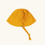 Little Green Radicals summer sun reversible sunhat shown on the yellow gold side. 