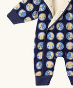 Close up of the Little Green Radicals sun folk blue sherpa fleece lined snowsuit.