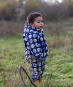 Young child wearing a Little Green Radicals sun folk blue sherpa fleece lined snowsuit.