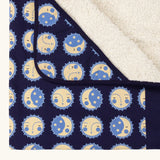 Close up of the hood on the Little Green Radicals sun folk navy organic cotton sherpa hooded baby blanket .