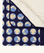 Close up of the hood on the Little Green Radicals sun folk navy organic cotton sherpa hooded baby blanket .