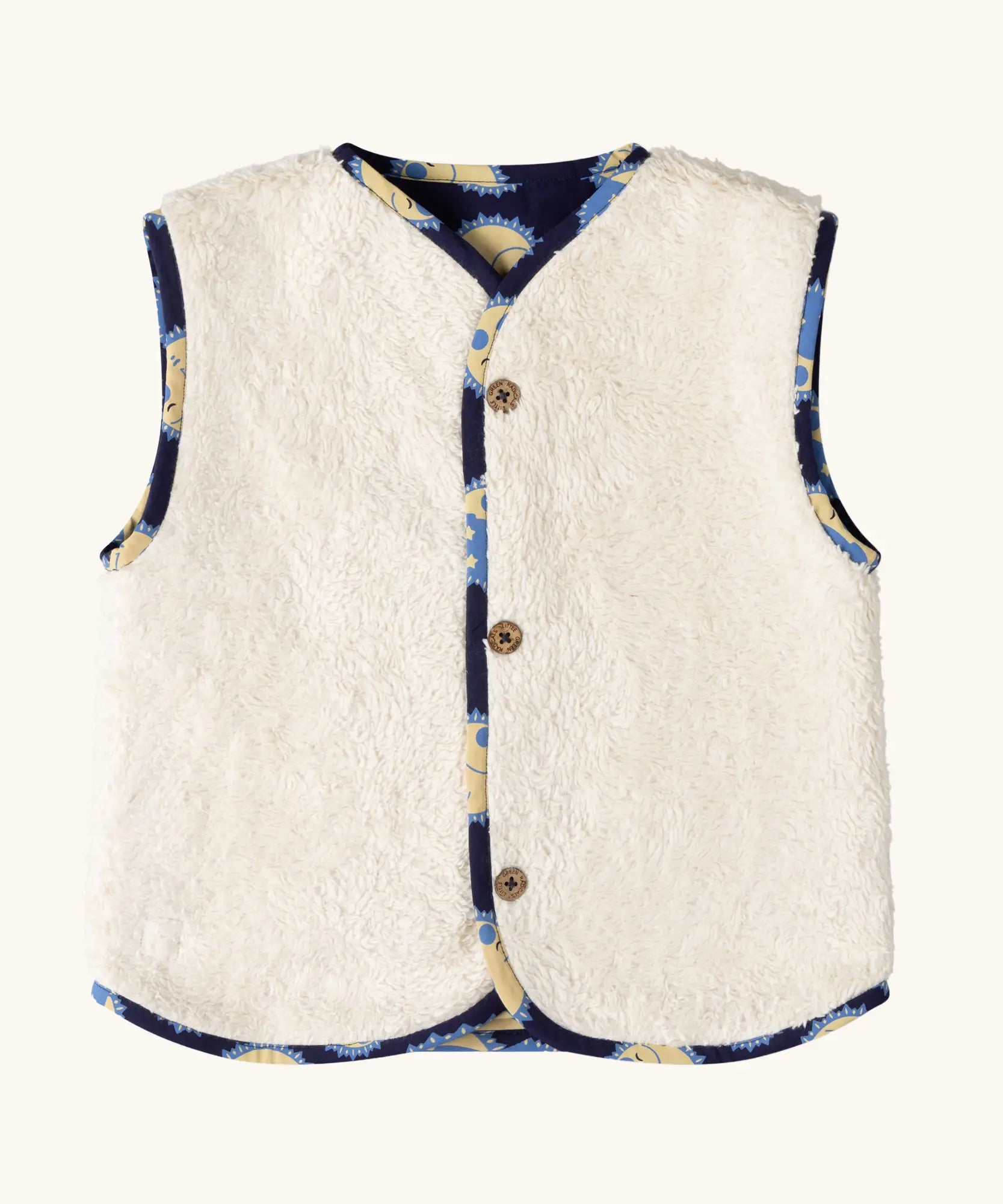 Sherpa fleece side of the Little Green Radicals sun folk organic cotton sherpa fleece reversible gilet.