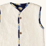 Close up of the sherpa fleece on the Little Green Radicals sun folk organic cotton sherpa fleece reversible gilet. 