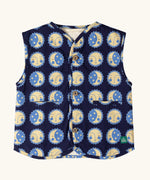 Little Green Radicals sun folk organic cotton sherpa fleece reversible gilet. Navy blue gilet with repeat sun and moon sun folk print on one side and sherpa fleece on the other. 