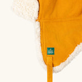 Close up of the Little Green Radicals sherpa fleece lined yellow gold corduroy cosy hat.