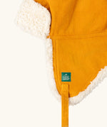 Close up of the Little Green Radicals sherpa fleece lined yellow gold corduroy cosy hat.