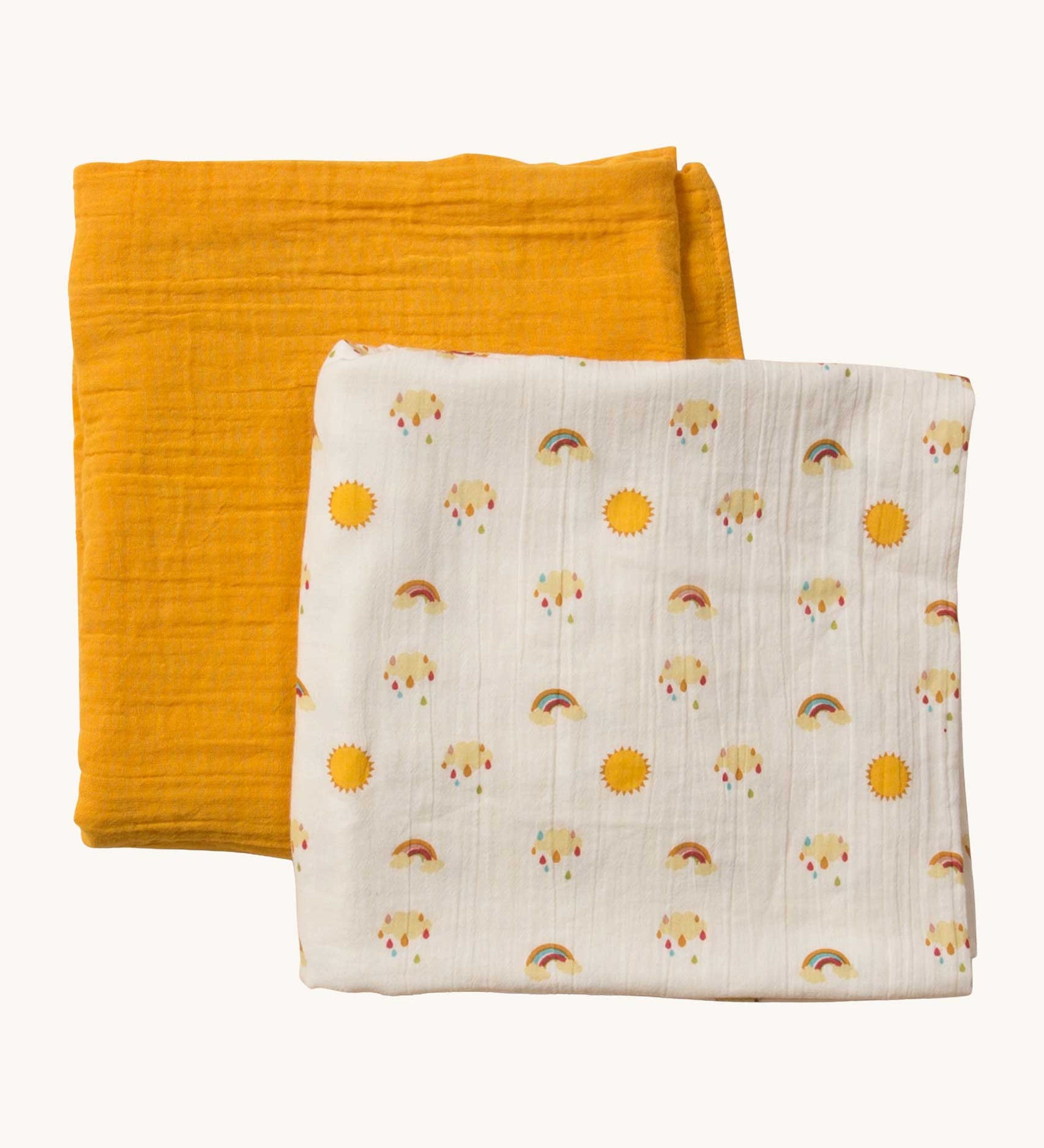 A Little Green Radicals Sunshine & Rainbows Organic Baby Muslin Set. A  2 Pack of muslin cloths, one is plain yellow gold and the other has an all over print featuring rainbows, sun and rainbow rain clouds. Little green Radicals have a wide range of organic cotton, Fairtrade children's clothing and outerwear available here at Babipur.