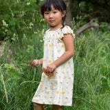 A child wearing the Little Green Radicals Sunshine & Rainbows Pocket Playdays Dress. Little green Radicals have a wide range of organic cotton, Fairtrade children's clothing and outerwear available here at Babipur.