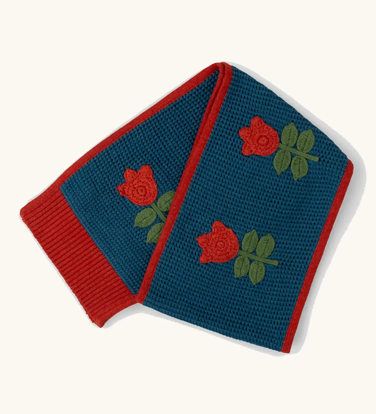 Little Green Radicals tulips knitted blue scarf. Blue scarf with red tulips and red trim.