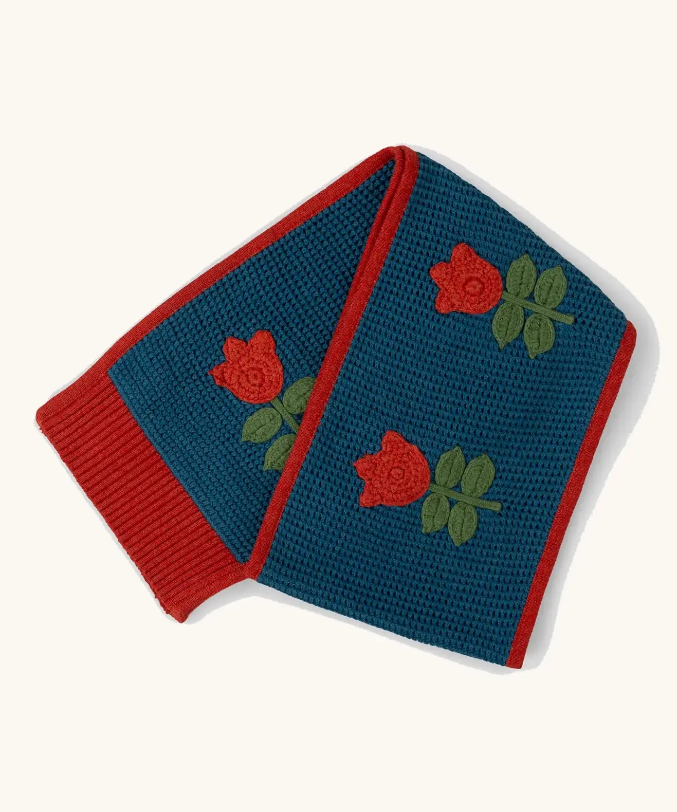 Little Green Radicals tulips knitted blue scarf. Blue scarf with red tulips and red trim.