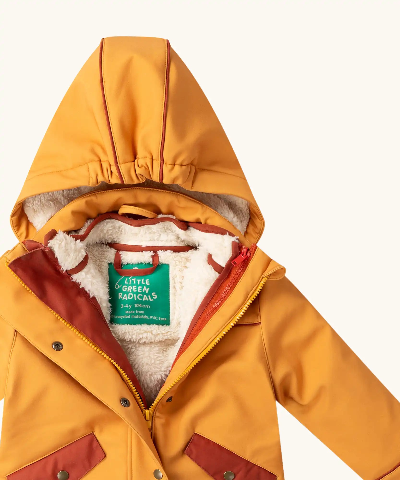 Close up of the Little Green Radicals  yellow gold recycled waterproof 3 in 1 coat showing the hood. Yellow gold waterproof coat with a removable fleece layer inside. 
