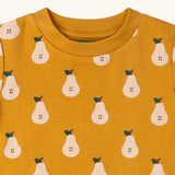 Close up of the neckline on the Little Green Radicals yellow gold summer pears short sleeve organic cotton t-shirt. 