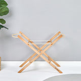 Little Green Sheep Moses Basket Stand pictured in a room with a grey coloured wall