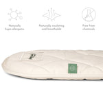 A side view of the Little Green Sheep Moses Basket Mattress