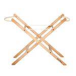 Little Green Sheep moses basket stand pictured on a plain background