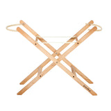 Little Green Sheep moses basket stand pictured on a plain background