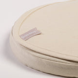 A close up of the corder of a Little Green Sheep Organic Moses Basket / Pram Mattress Protector