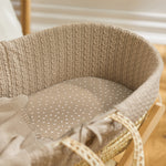 Little Green Sheep Organic Moses Basket Jersey Fitted Sheet in truffle rice pictured in a moses basket