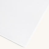 Little Green Sheep Organic Cot Bed Jersey Fitted Sheet pictured on a plain background 