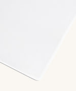 Little Green Sheep Organic Cot Bed Jersey Fitted Sheet pictured on a plain background 