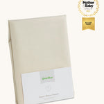 Little Green Sheep Organic Junior Mattress Protector pictured in packaging on a plain background