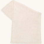 Little Green Sheep Organic Knitted Cellular Baby Blanket in linen on a plain background