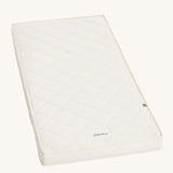 Little Green Sheep Twist Natural SnuzKot Mattress pictured on a plain background