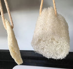 two LoofCo Loofah Washing-Up Pads hanging up