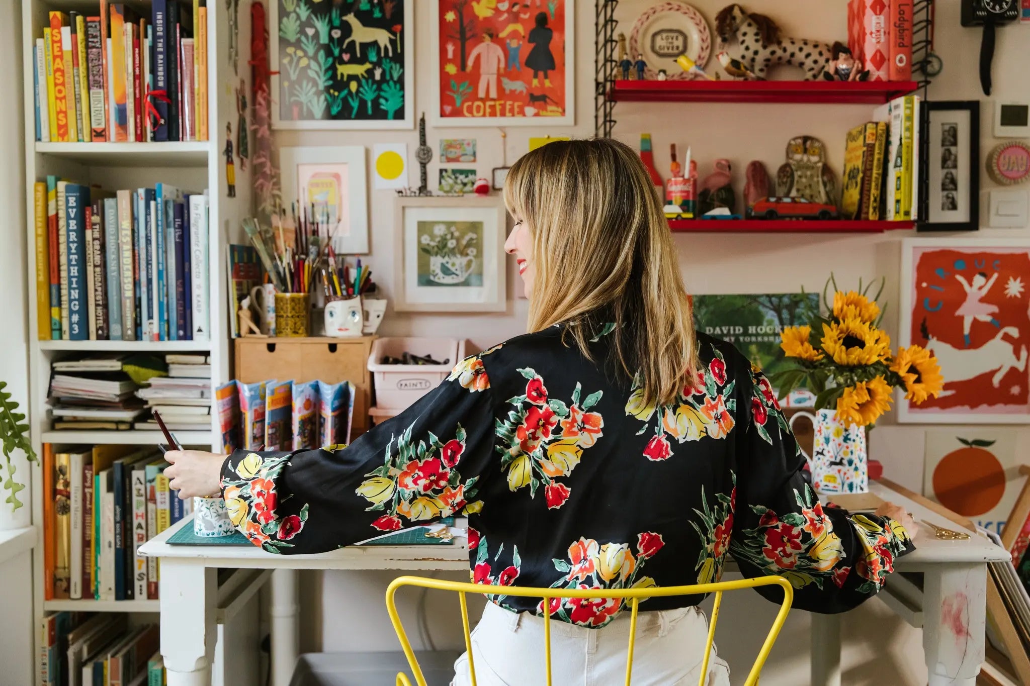 Louise Lockhart, the Yorkshire based illustrator and artist, in her art studio surrounded by her drawings and artwork.